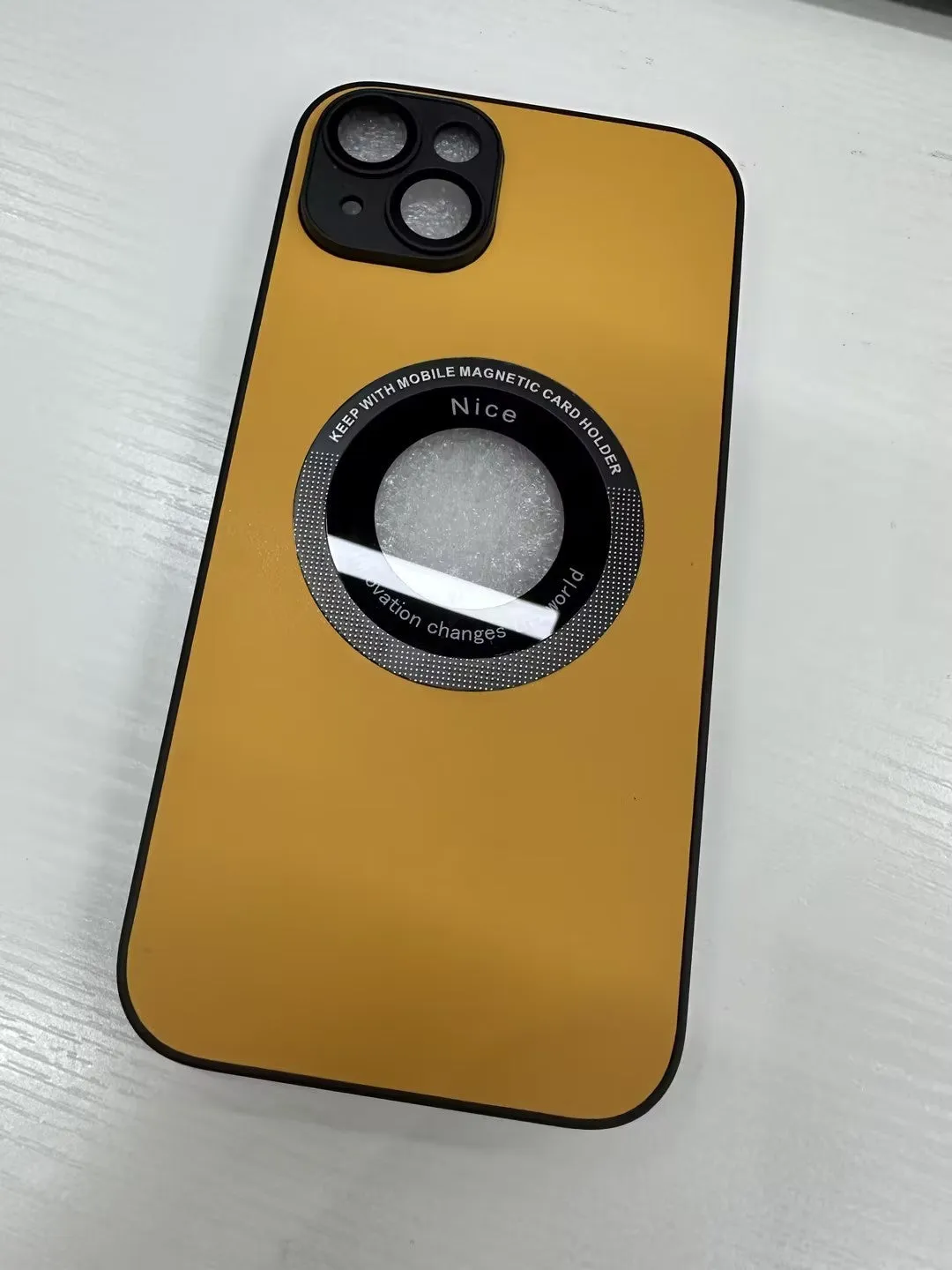 iPhone 15 Pro litchi grain leather magnetic suction phone case in black showing back cover texture