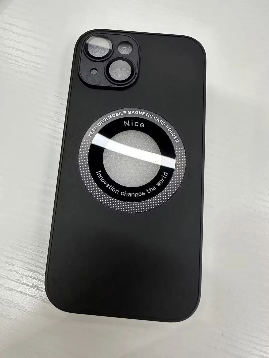 iPhone 15 Pro litchi grain leather magnetic suction phone case in black showing back cover texture