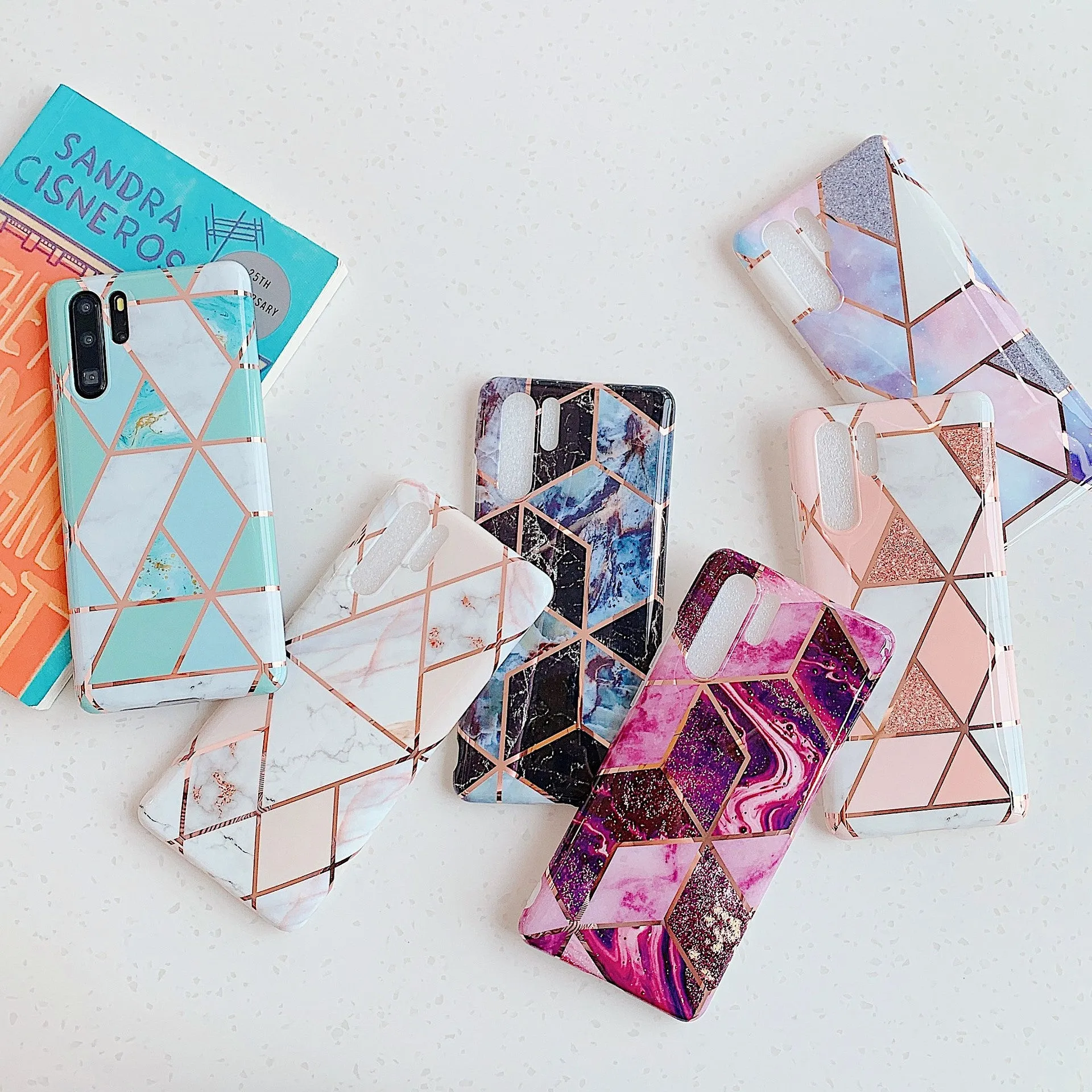 Electroplated marble pattern TPU back cover case for a Huawei or Samsung smartphone.
