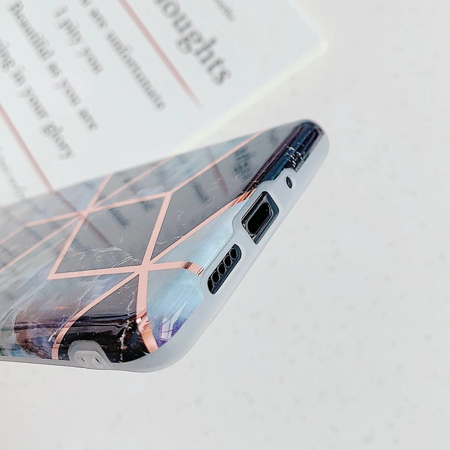 Electroplated marble pattern TPU back cover case for a Huawei or Samsung smartphone.