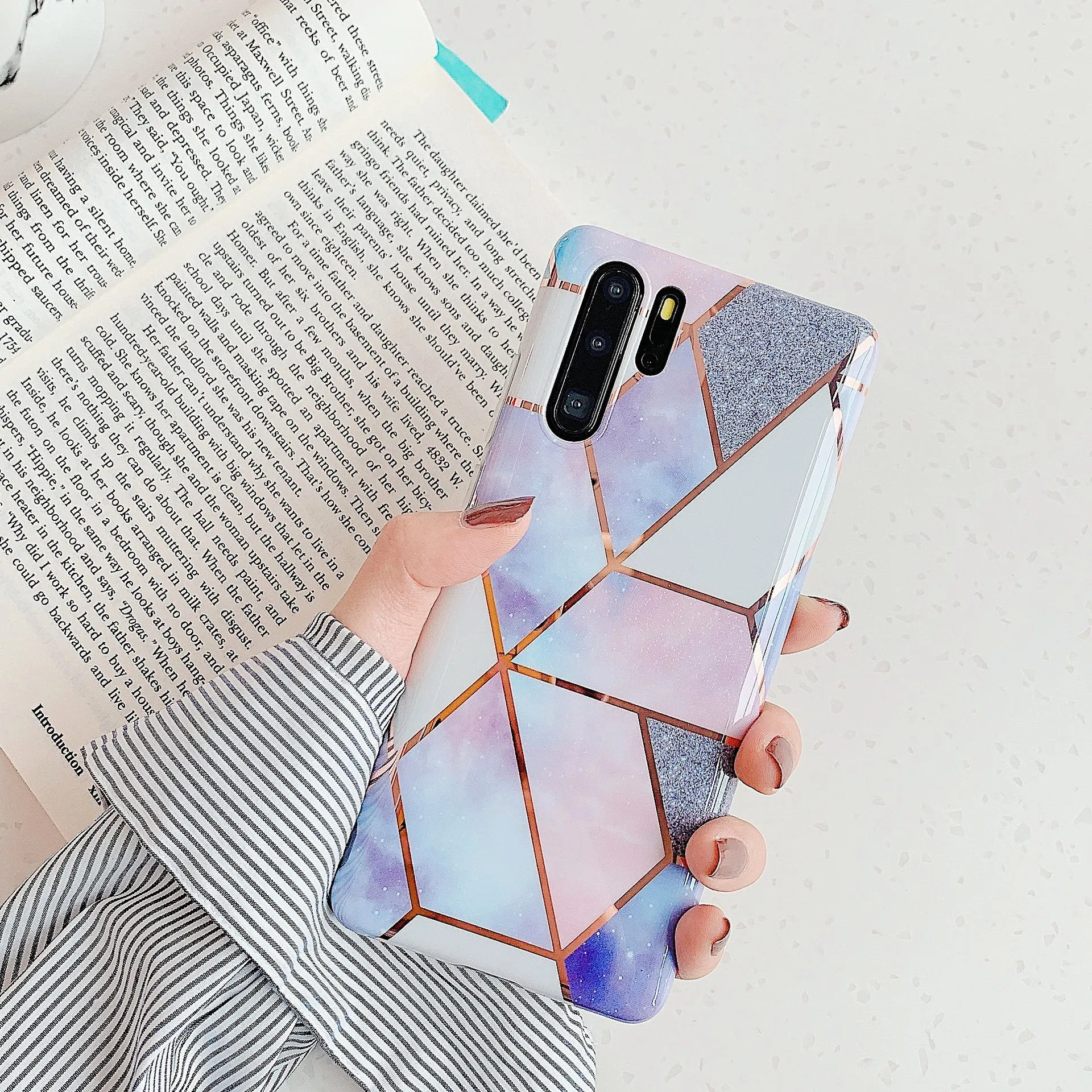 Electroplated marble pattern TPU back cover case for a Huawei or Samsung smartphone.