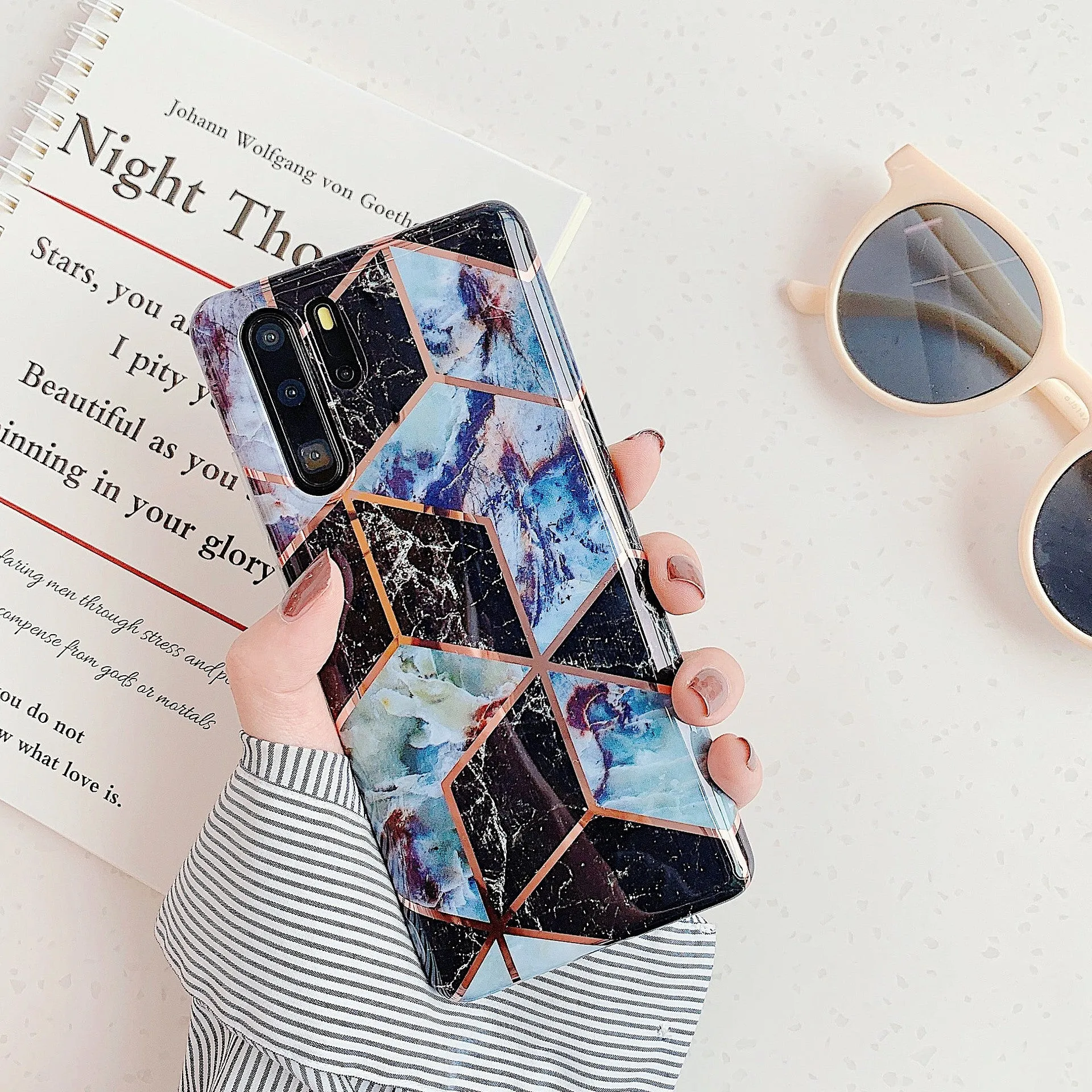 Electroplated marble pattern TPU back cover case for a Huawei or Samsung smartphone.