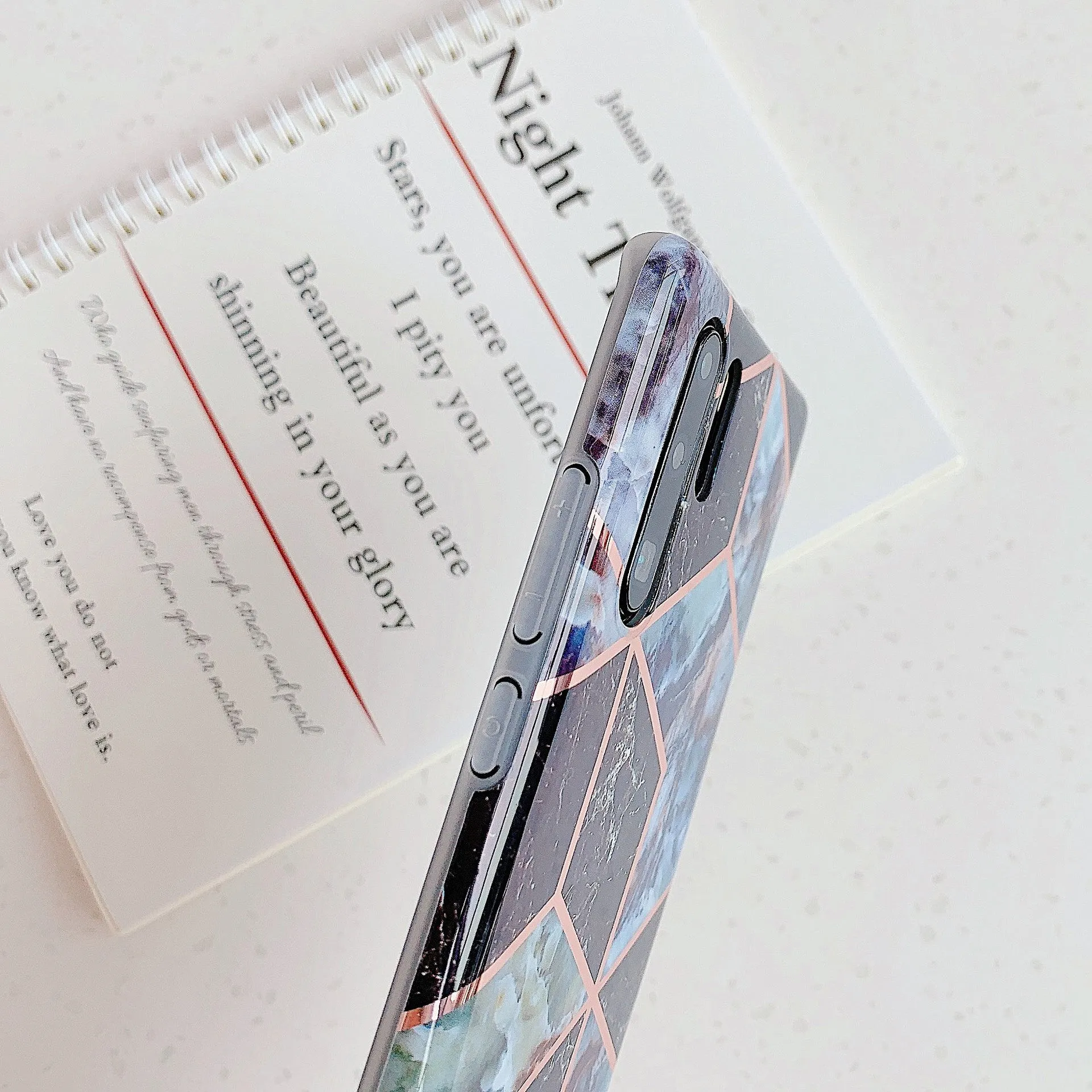 Electroplated marble pattern TPU back cover case for a Huawei or Samsung smartphone.