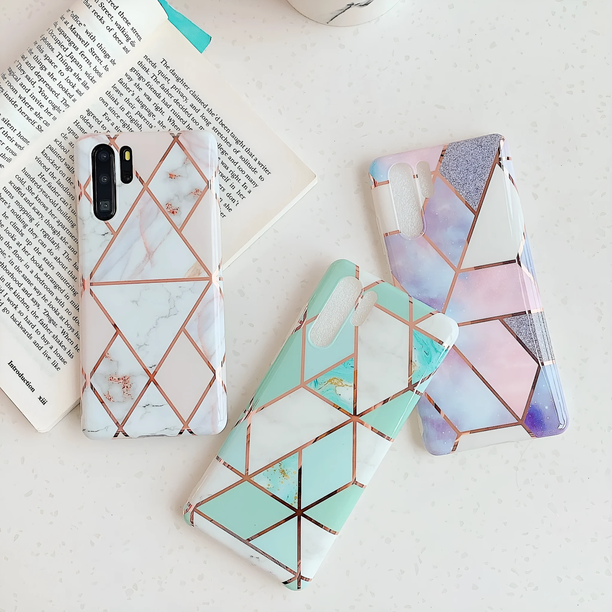 Electroplated marble pattern TPU back cover case for a Huawei or Samsung smartphone.