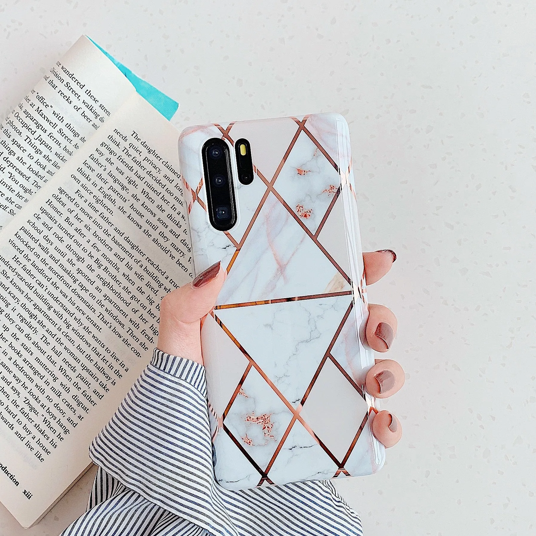 Electroplated marble pattern TPU back cover case for a Huawei or Samsung smartphone.