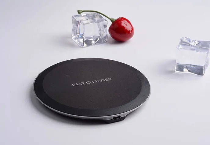 Ultra-thin wireless charger for mobile phone, black, with USB cable, showing charging indicator light