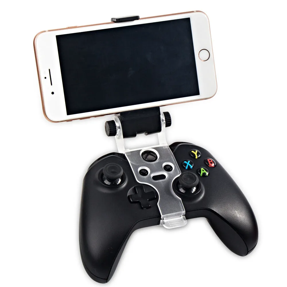 Black universal mobile phone holder clipped onto a car air vent, showing 360-degree rotation and clamp for smartphone