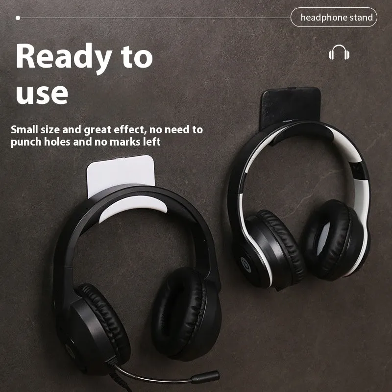 Black plastic headphone bracket mounted on wall with universal fit for headset storage