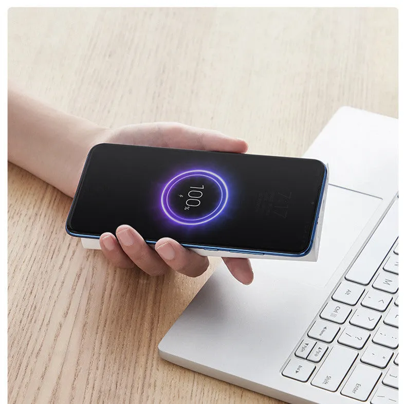 White or black 10000mAh capacity power bank showing USB-C port and wireless charging symbol