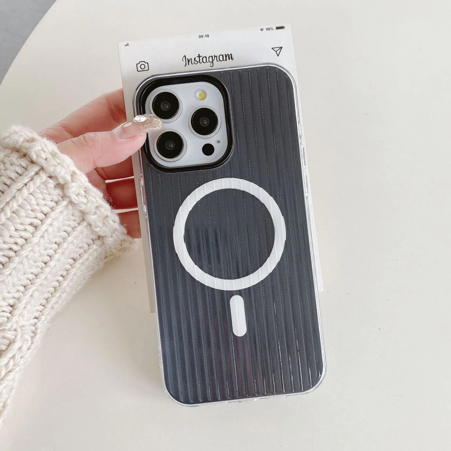 Magnetic stripe two-in-one TPU phone case in black with corrugated shell for iPhone 12 Pro