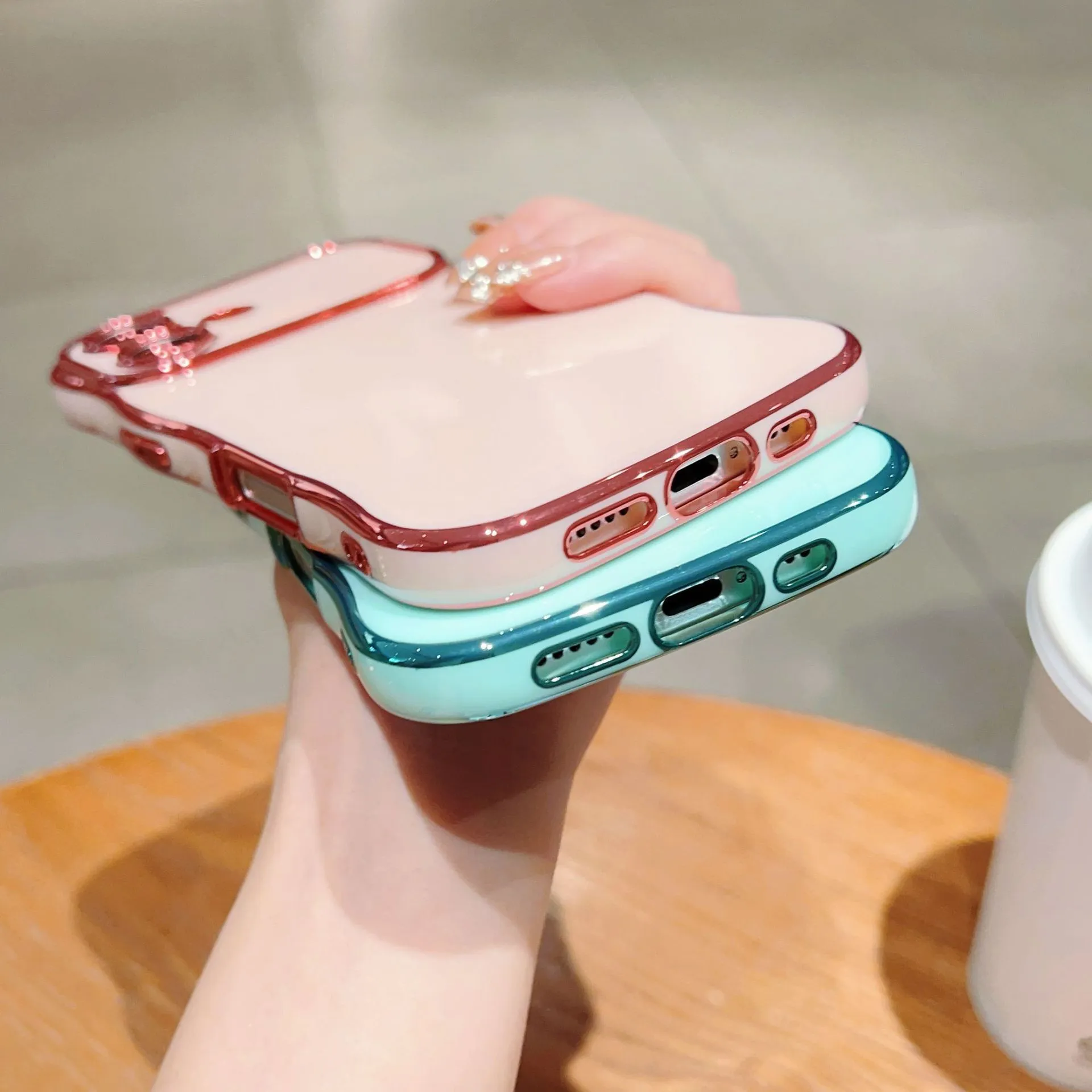 TPU phone case with electroplated wave design and large window, black colour, positioned to show reflective surface