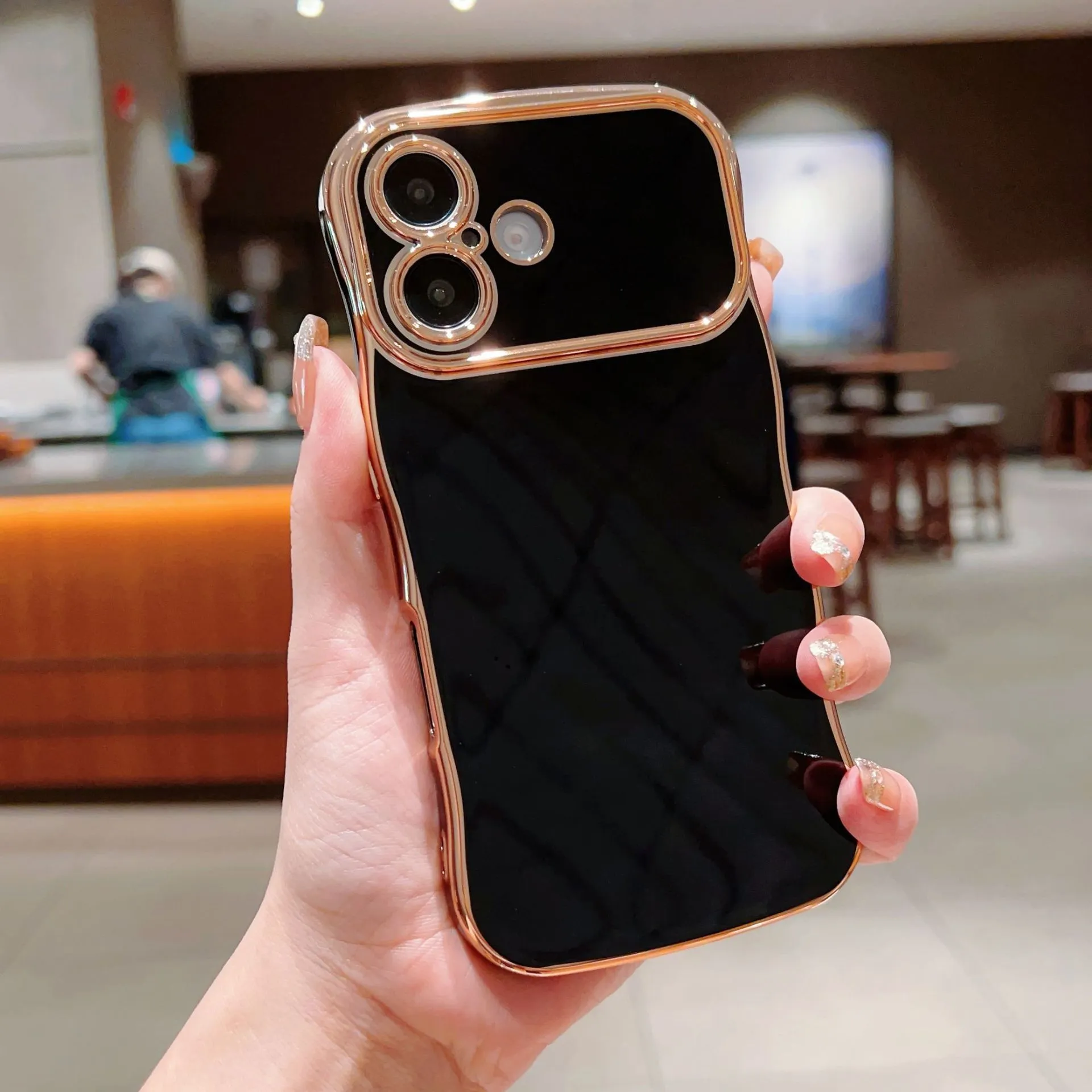 TPU phone case with electroplated wave design and large window, black colour, positioned to show reflective surface