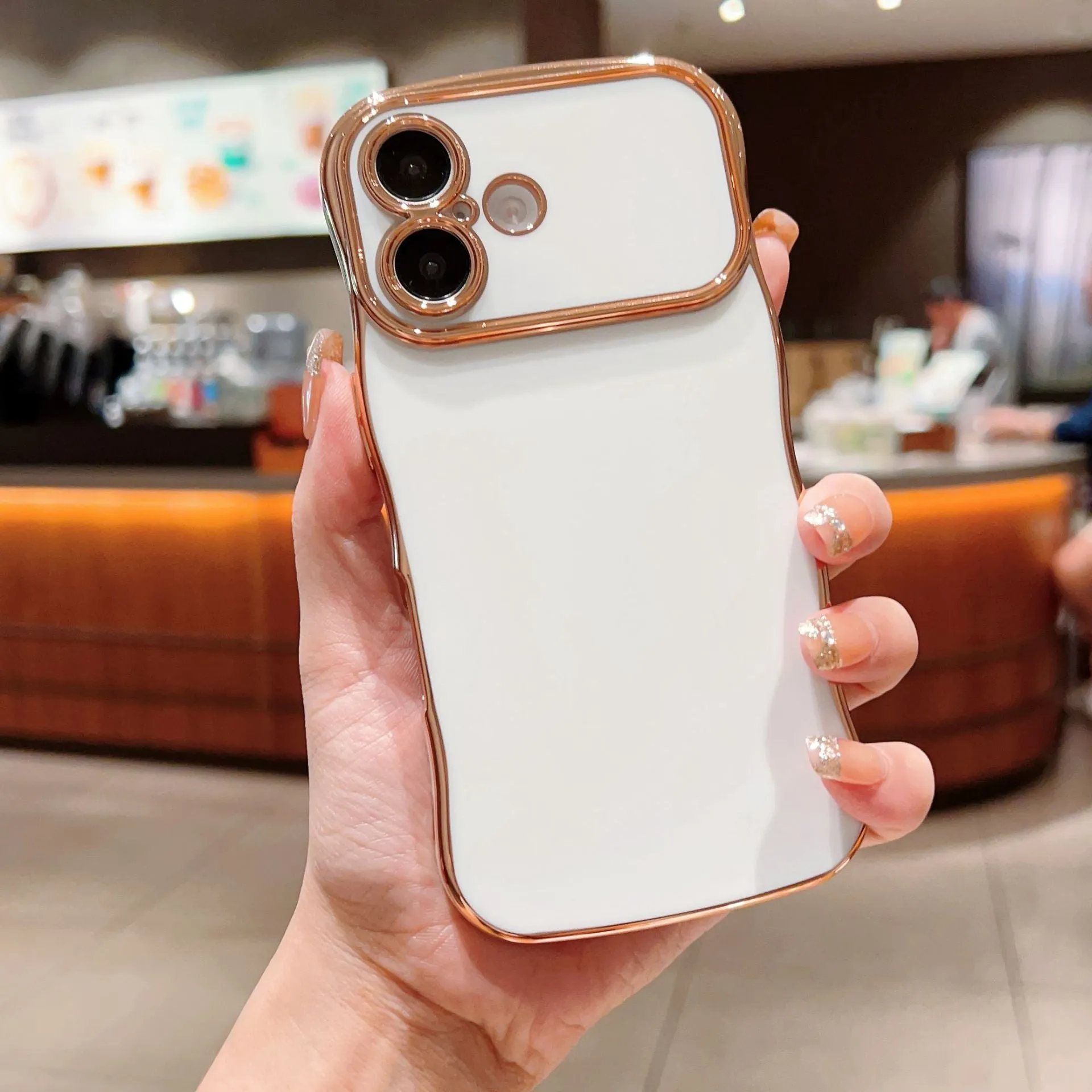 TPU phone case with electroplated wave design and large window, black colour, positioned to show reflective surface
