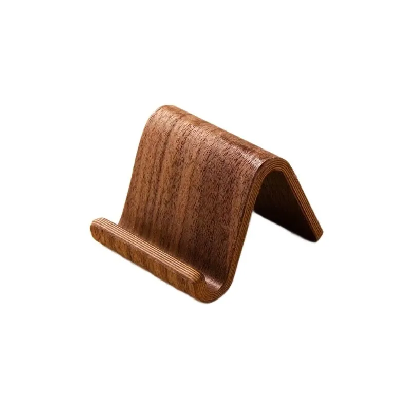 Walnut wood mobile phone bracket holding a smartphone on a wooden desk