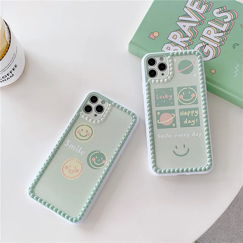 Green TPU phone case with geometric smiley face and polka dot pattern for multiple iPhone models.