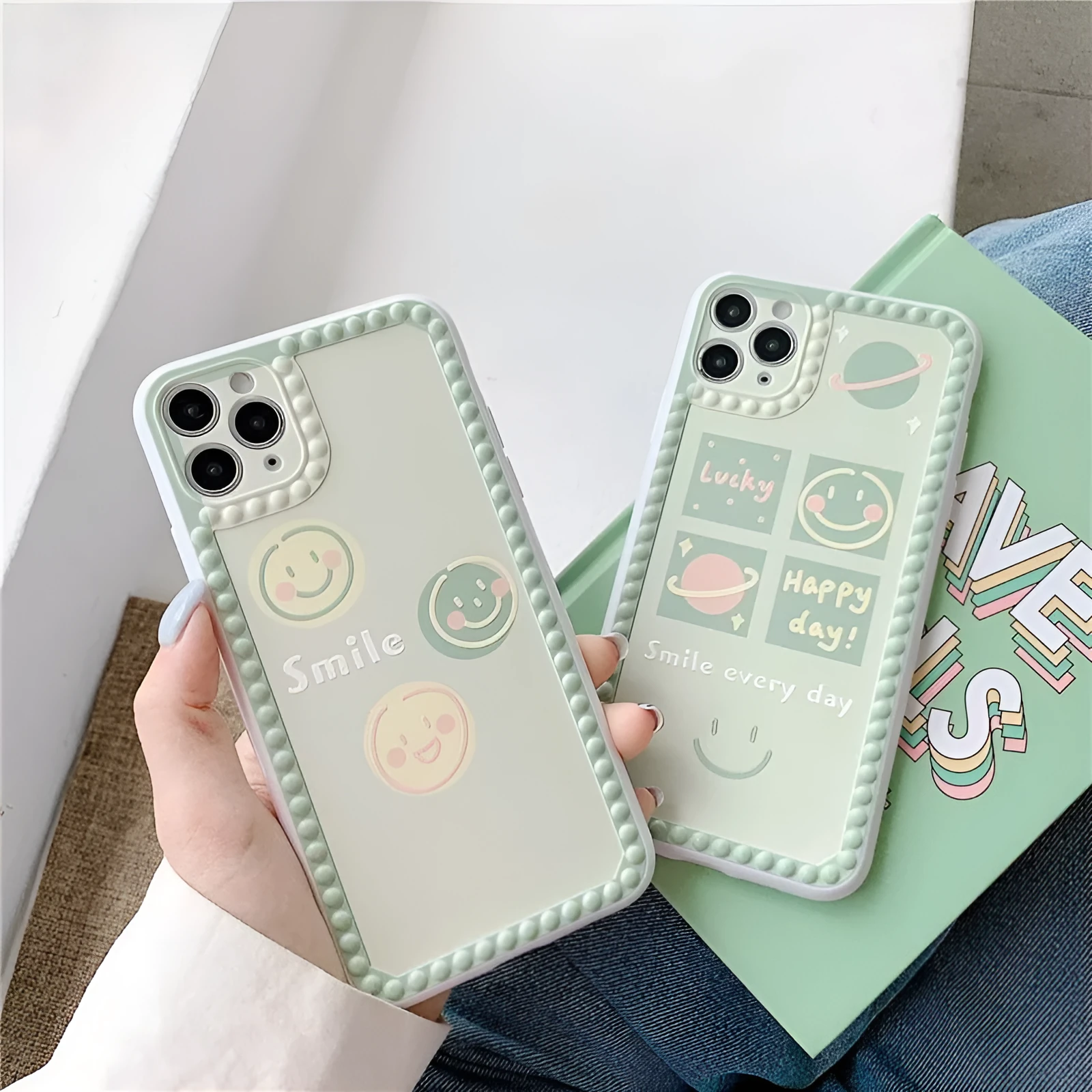 Green TPU phone case with geometric smiley face and polka dot pattern for multiple iPhone models.