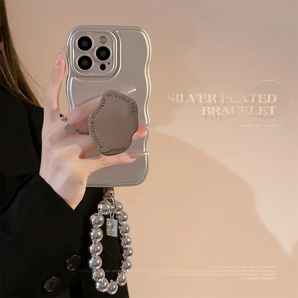 Silver metal bracket phone case for iPhone with electroplated finish and hand bead detail on gray background