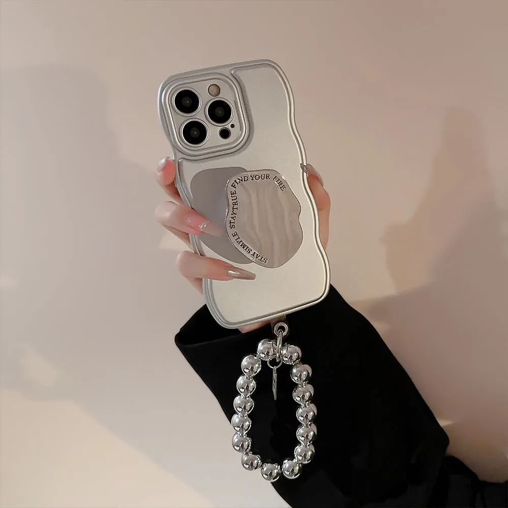 Silver metal bracket phone case for iPhone with electroplated finish and hand bead detail on gray background