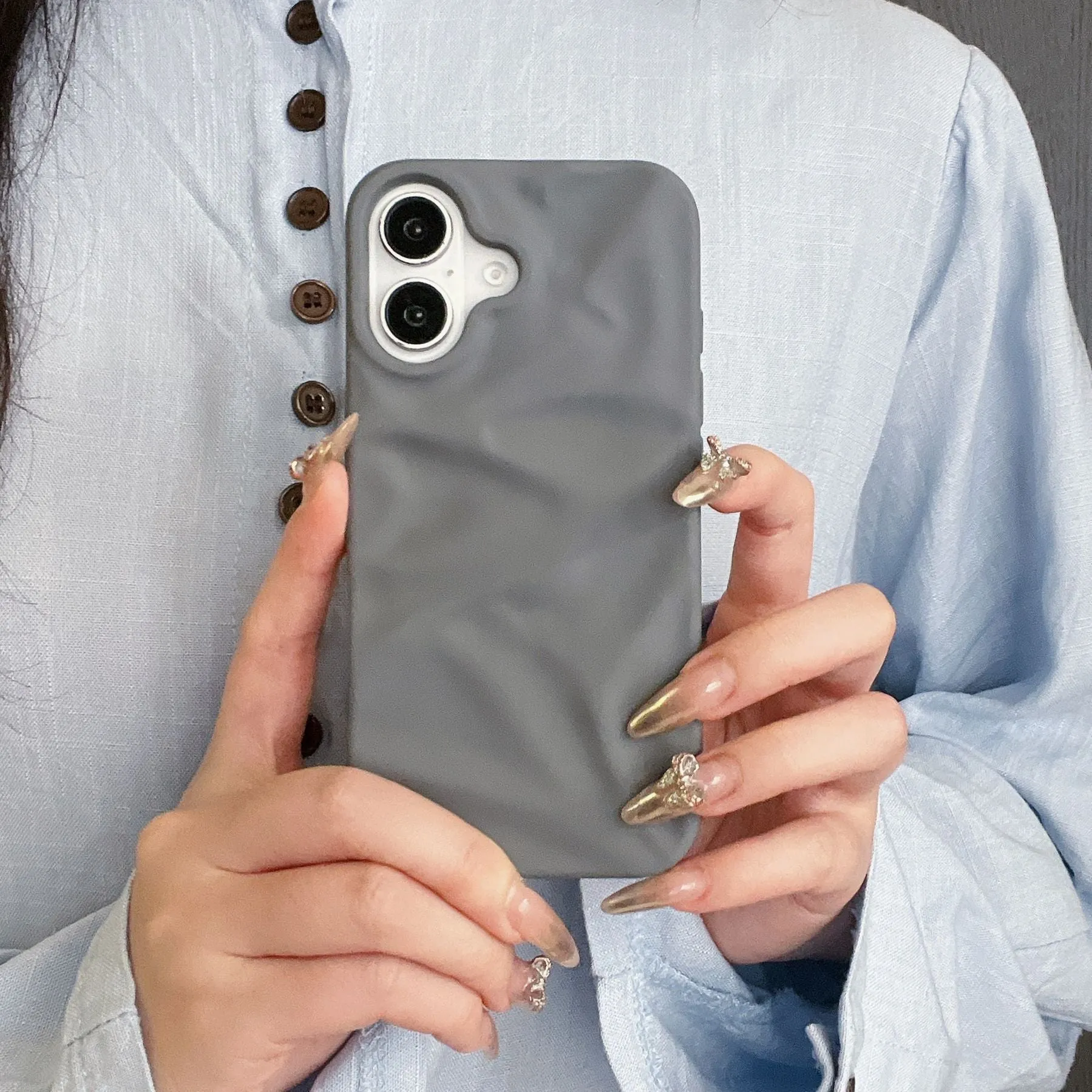 High-grade three-dimensional pleated pattern silicone phone case for iPhone 17 series in black, soft shell construction with fall protection
