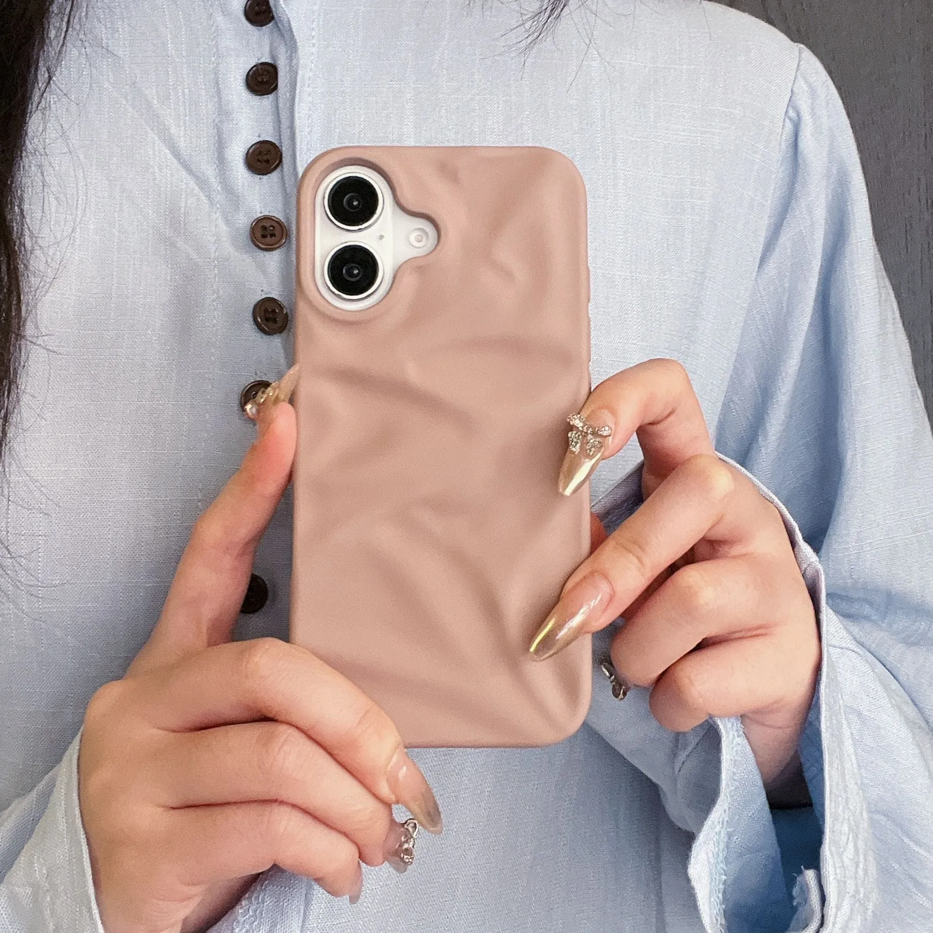 High-grade three-dimensional pleated pattern silicone phone case for iPhone 17 series in black, soft shell construction with fall protection