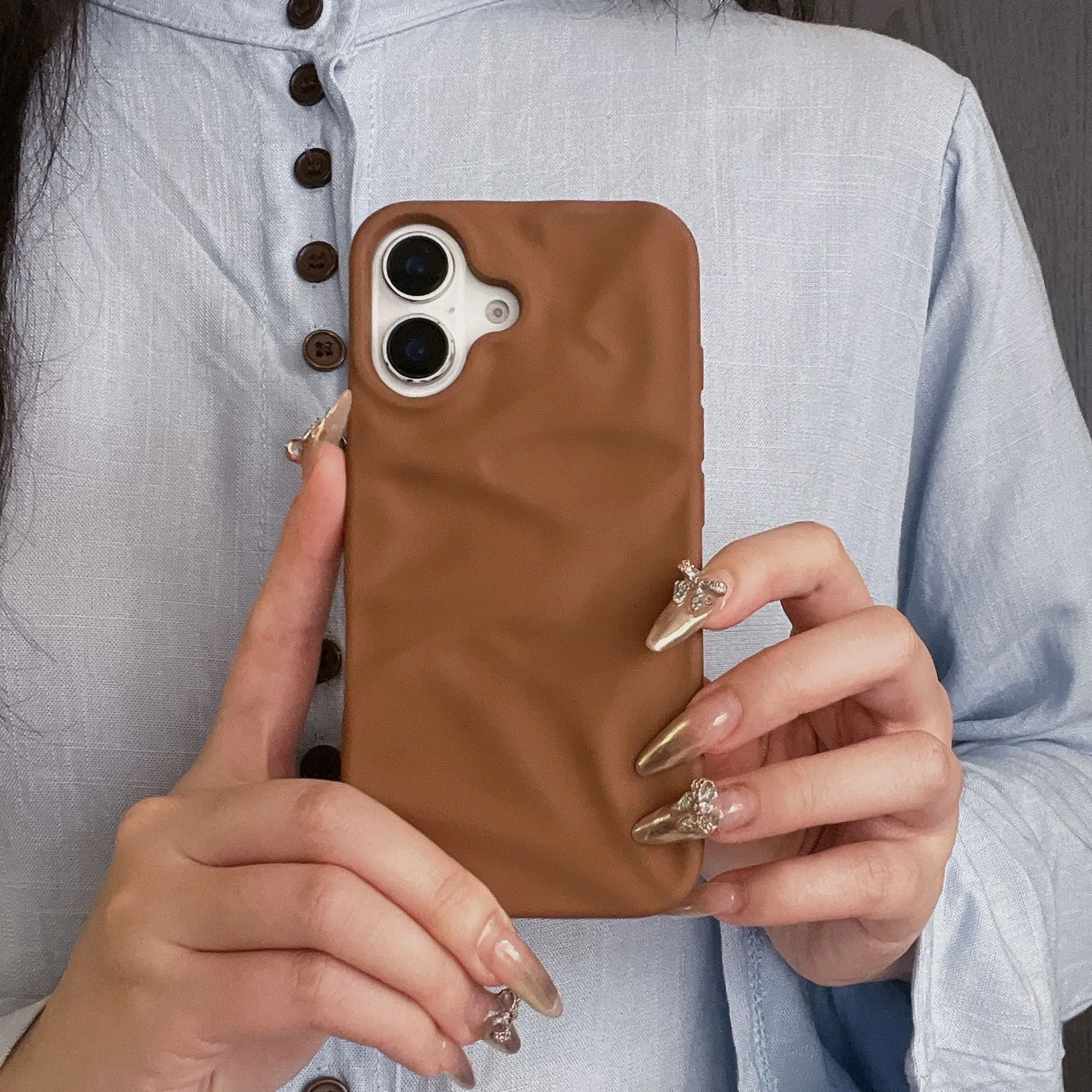 High-grade three-dimensional pleated pattern silicone phone case for iPhone 17 series in black, soft shell construction with fall protection
