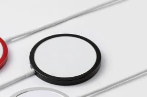 MagSafe compatible magnetic wireless charger in silver, black, blue, and red metal finishes for iPhone.