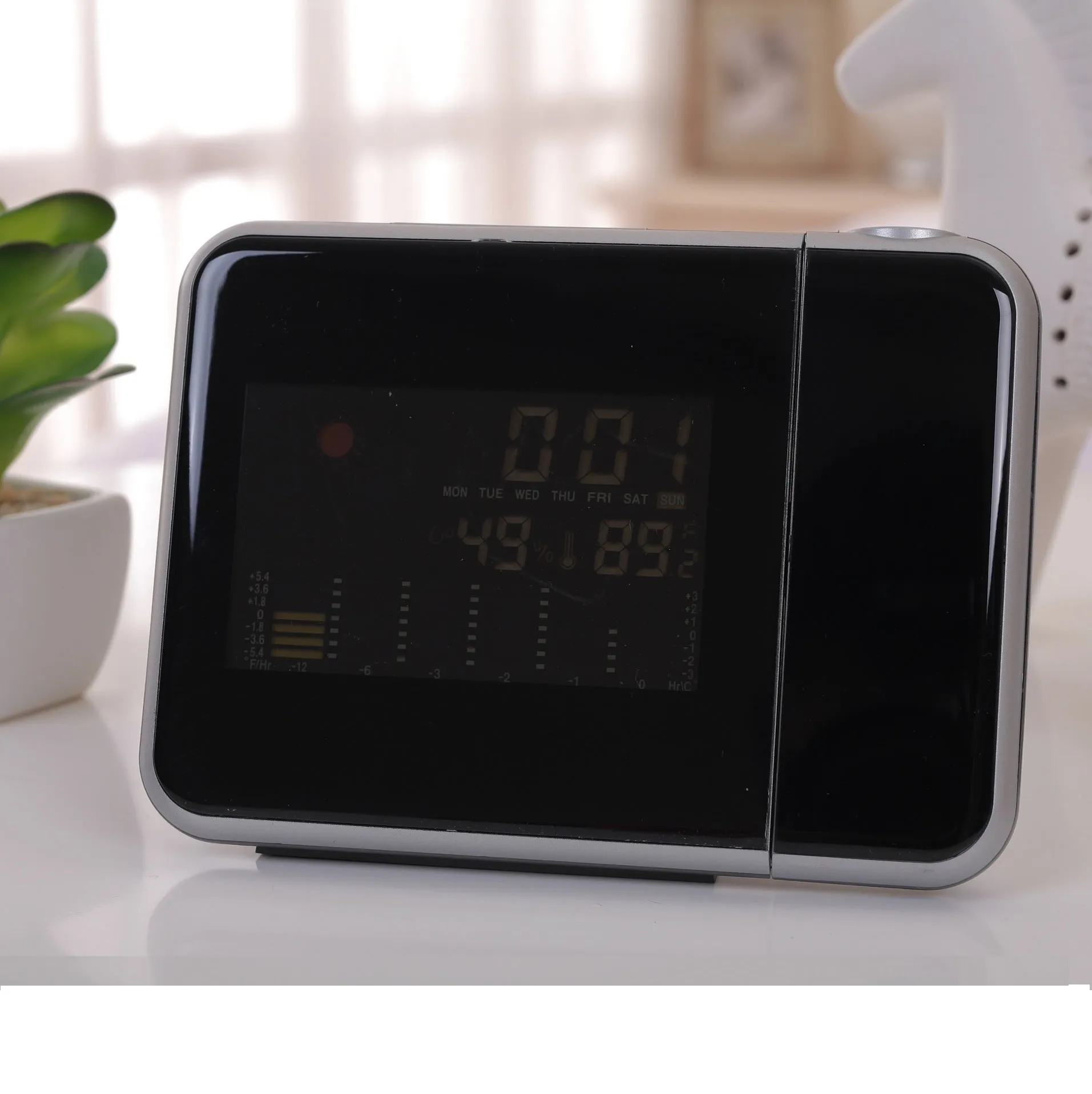 Compact plastic home electronic clock with USB cable in black, dimensions 16 by 6 by 12 centimetres