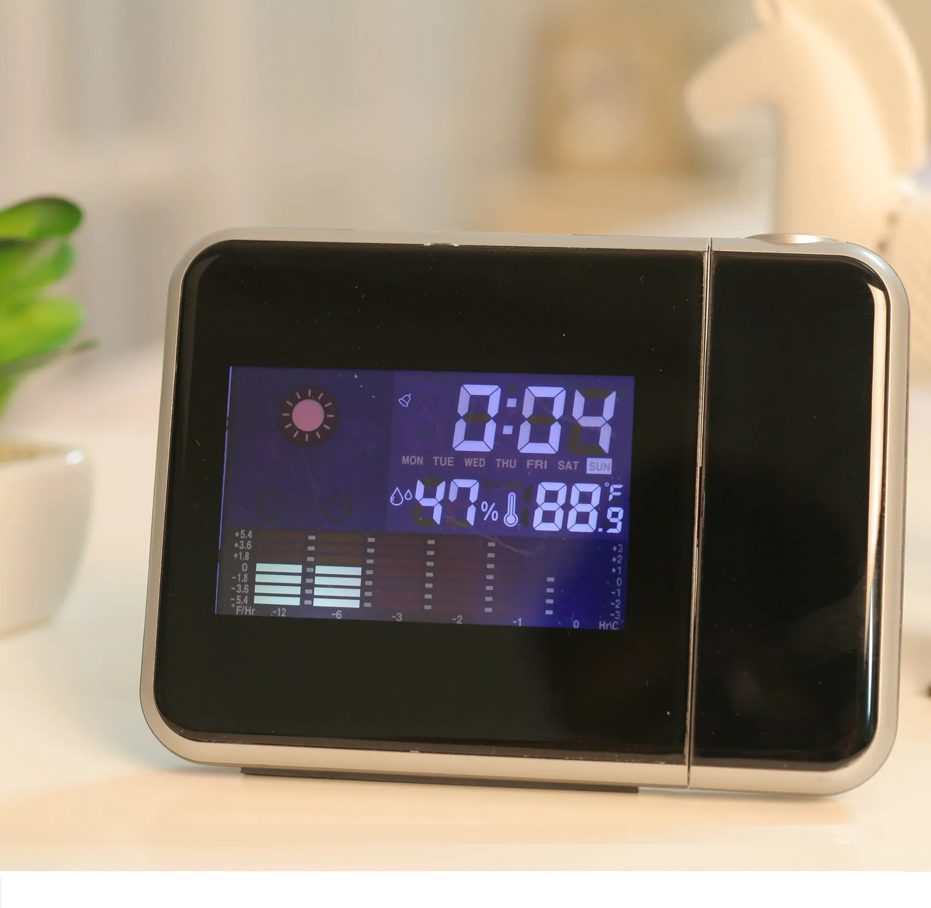 Compact plastic home electronic clock with USB cable in black, dimensions 16 by 6 by 12 centimetres