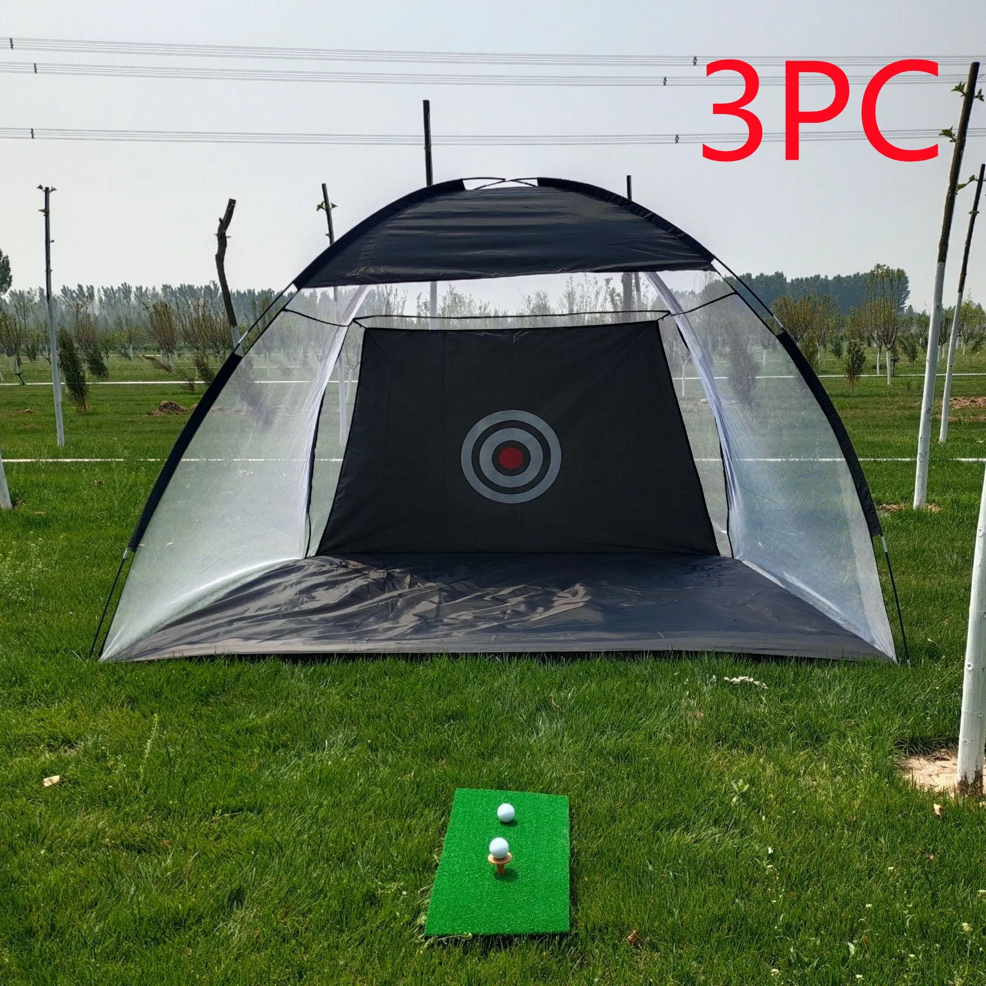 Black and green golf practice net tent set up on grass with fibreglass poles and target sheet