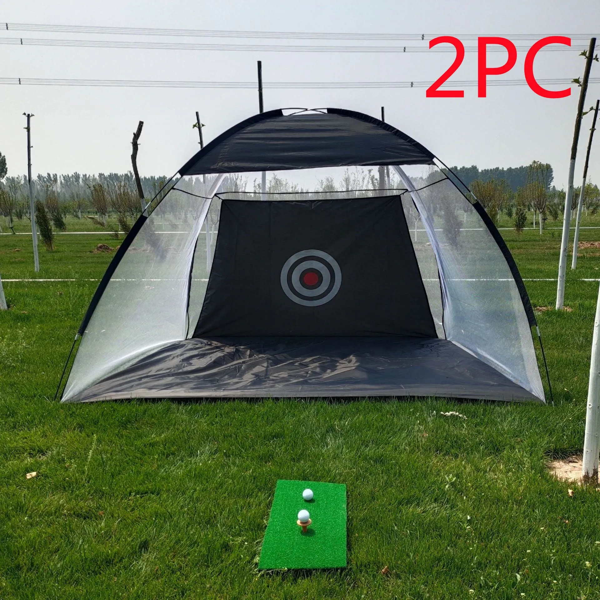 Black and green golf practice net tent set up on grass with fibreglass poles and target sheet