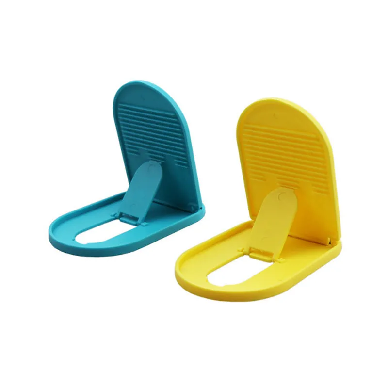 A foldable plastic mobile phone stand in a lazy bracket shape, shown in a selection of colours.