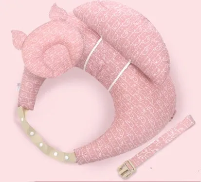 Multifunction nursing pillow with adjustable strap and white cotton cover for breastfeeding and baby support.