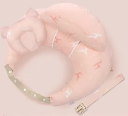 Multifunction nursing pillow with adjustable strap and white cotton cover for breastfeeding and baby support.