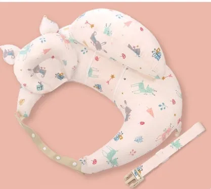 Multifunction nursing pillow with adjustable strap and white cotton cover for breastfeeding and baby support.