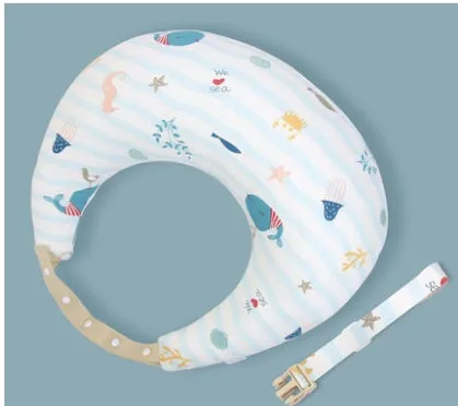 Multifunction nursing pillow with adjustable strap and white cotton cover for breastfeeding and baby support.