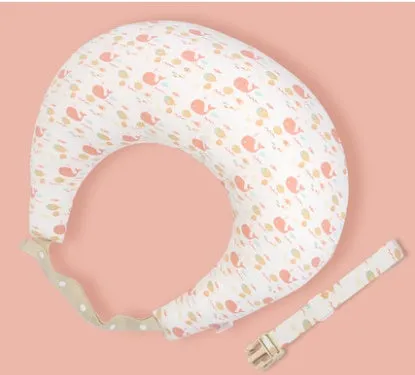 Multifunction nursing pillow with adjustable strap and white cotton cover for breastfeeding and baby support.