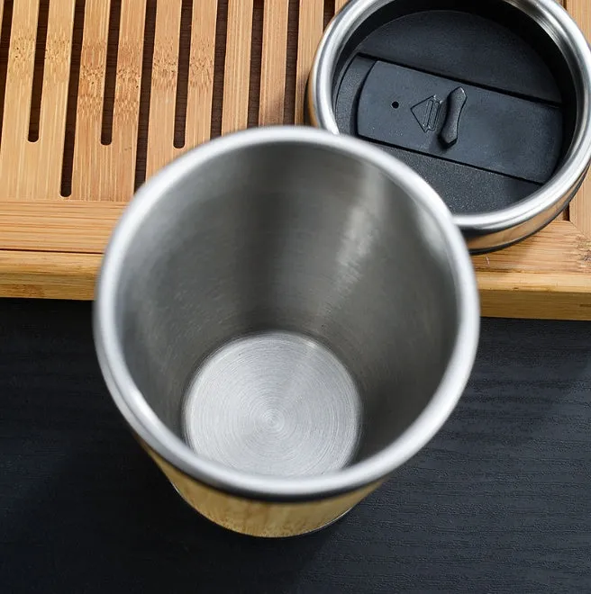 Natural bamboo coffee cup with stainless steel lining, 420ml capacity, leak-proof lid, and foam pad