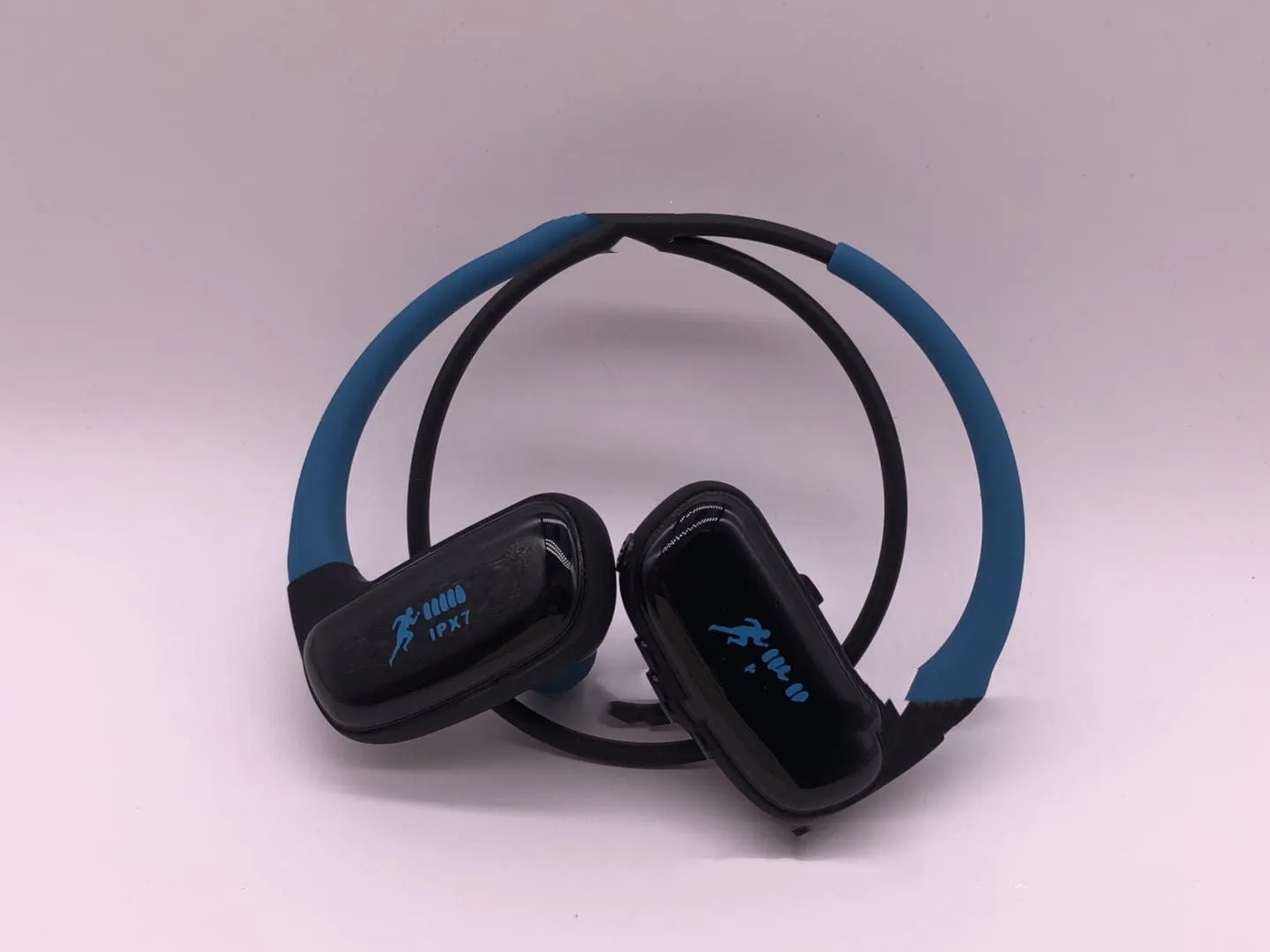 Wireless Bluetooth headset with bilateral earbuds, hanging ear design, 10m range, in black