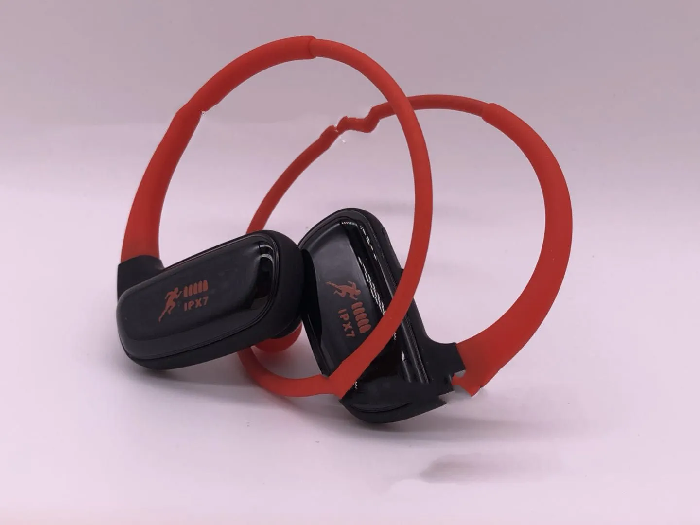 Wireless Bluetooth headset with bilateral earbuds, hanging ear design, 10m range, in black