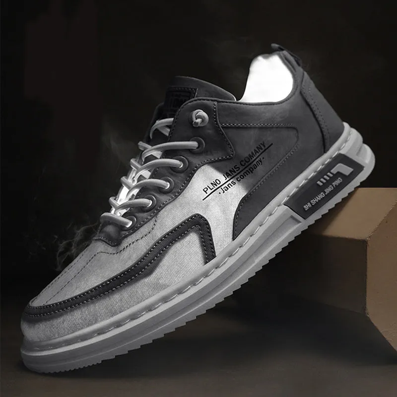 Men's green canvas lace-up sneakers with round toe, flat heel, and letter print side detail on a white background
