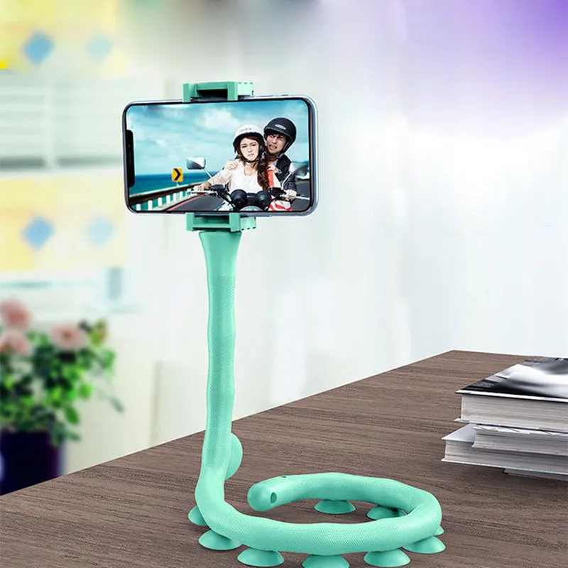 Flexible worm-style lazy bracket mobile phone holder with long silicone arm and black rubber suction cup base.
