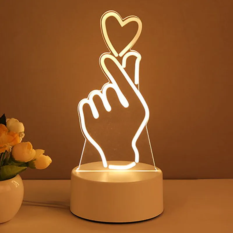 3D acrylic USB LED night light with unicorn design and warm white projection on a desk