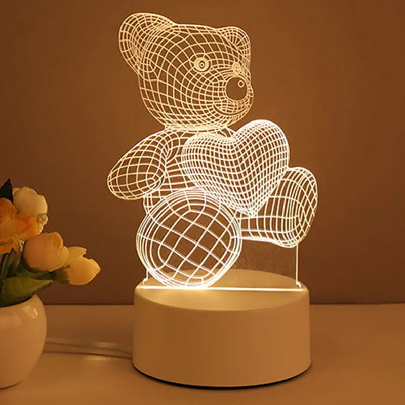 3D acrylic USB LED night light with unicorn design and warm white projection on a desk
