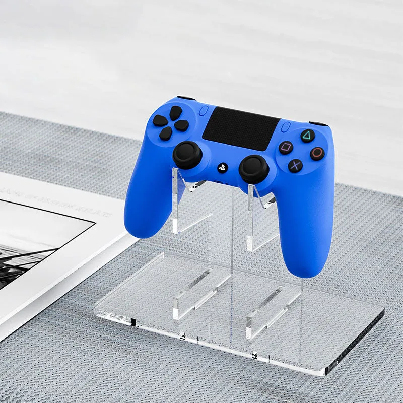 Compact controller stand for PS5 and Xbox Series in black bracket finish, measuring 11cm by 9.3cm, with a single controller placed upright