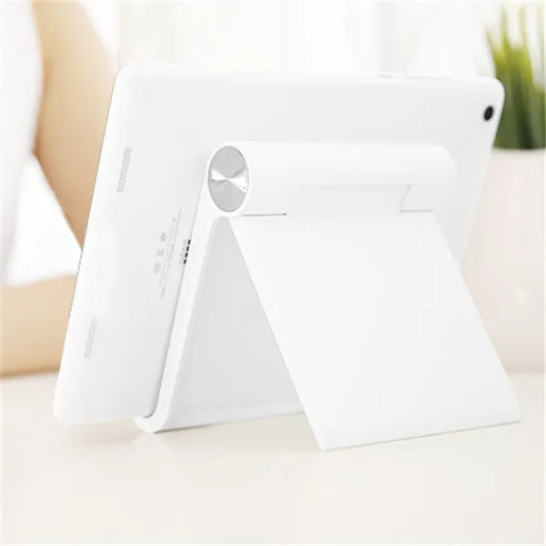 Folding plastic desktop stand holding a smartphone in black colour on a desk
