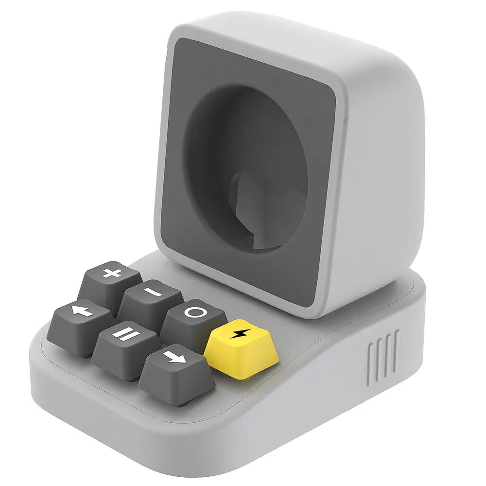 Silicone watch charger bracket in typewriter shape in grey, purple, and yellow colours on a desk