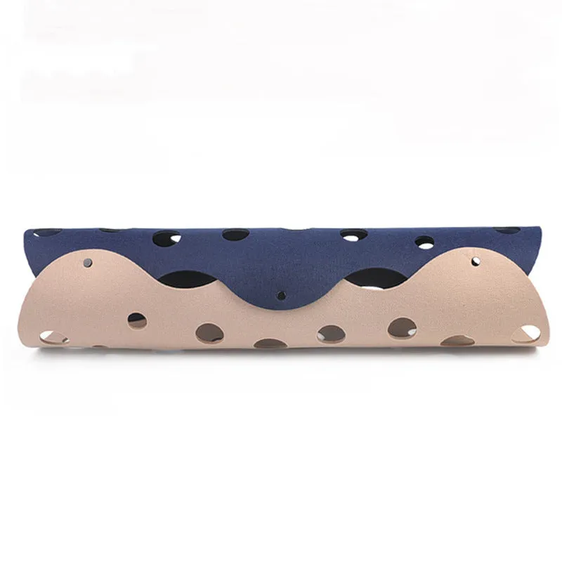 Deformable felt cat tunnel with peepholes in cement grey and orange, assembled on floor