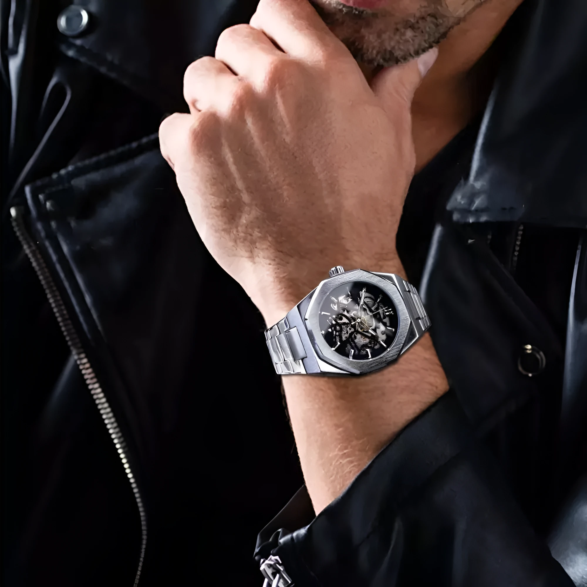 Men's mechanical automatic watch with skeleton dial, stainless steel case, and black genuine leather band on a white background