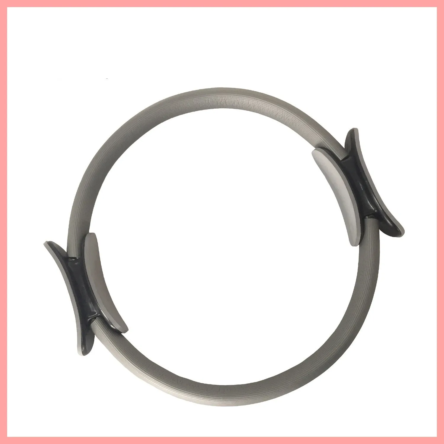 Pink pilates ring with ergonomic design on white background for yoga and home workout resistance training
