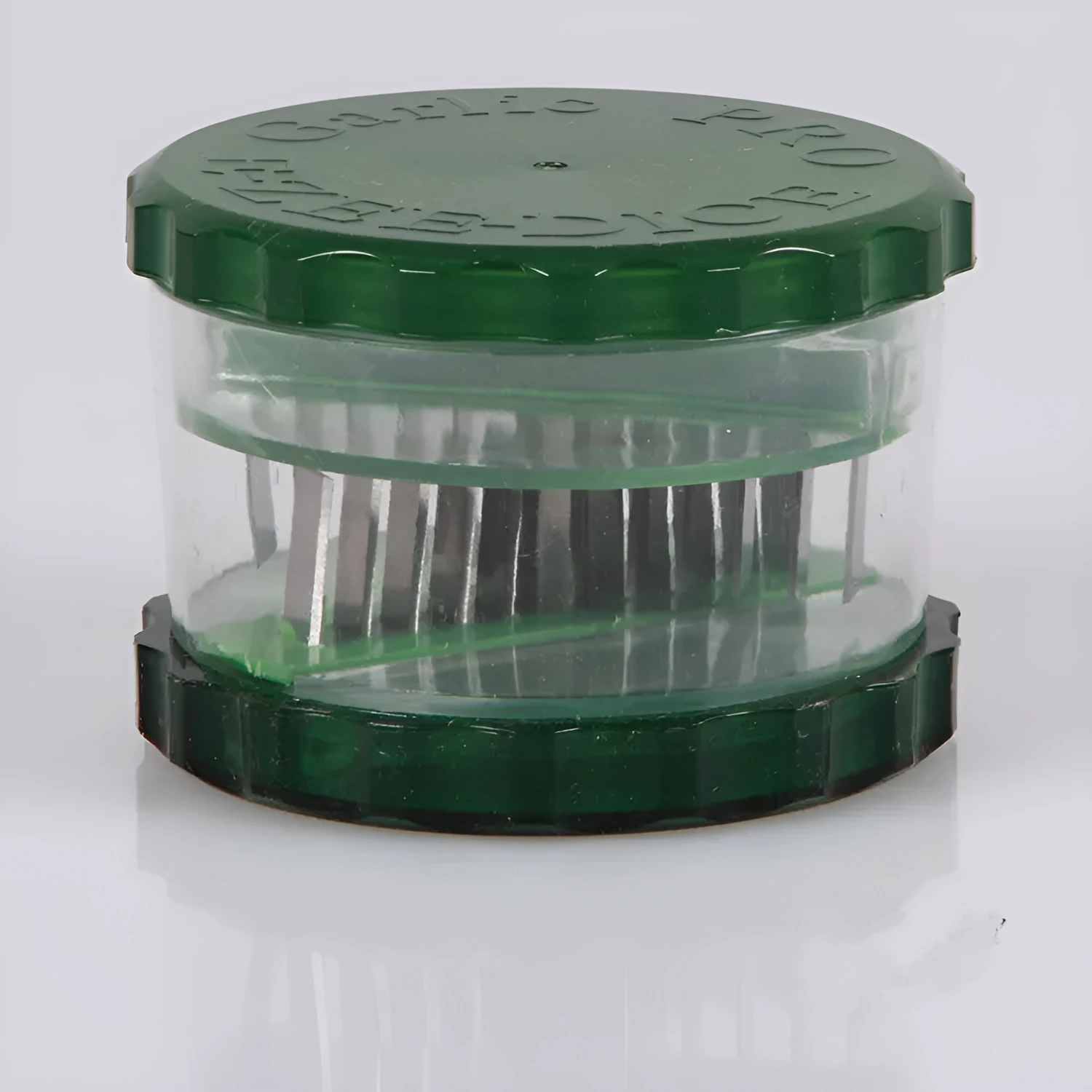Green transparent PP garlic peeler measuring 8.5 by 8.5 by 6 cm